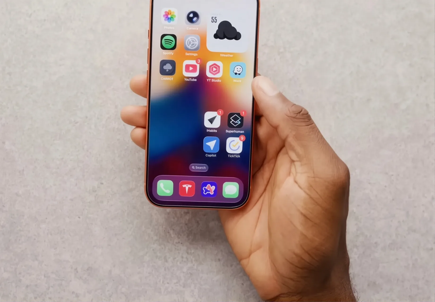 Marques Brownlee holding his iPhone, Copilot on its home screen